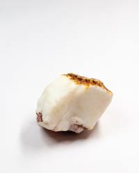 Opal No. 002, front face with flashes of colour under an orange ironstone crown