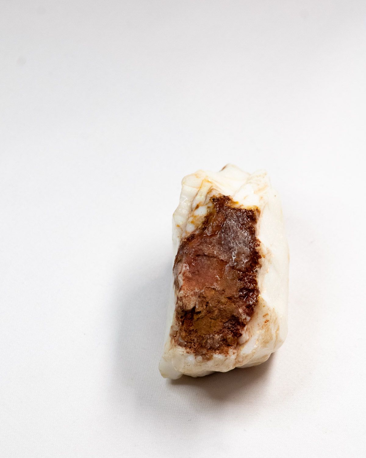 Opal No. 003, end view with a red-brown ironstone patch