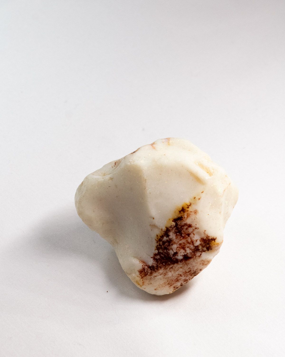 Opal No. 009, face showing colour with a patch of red ironstone