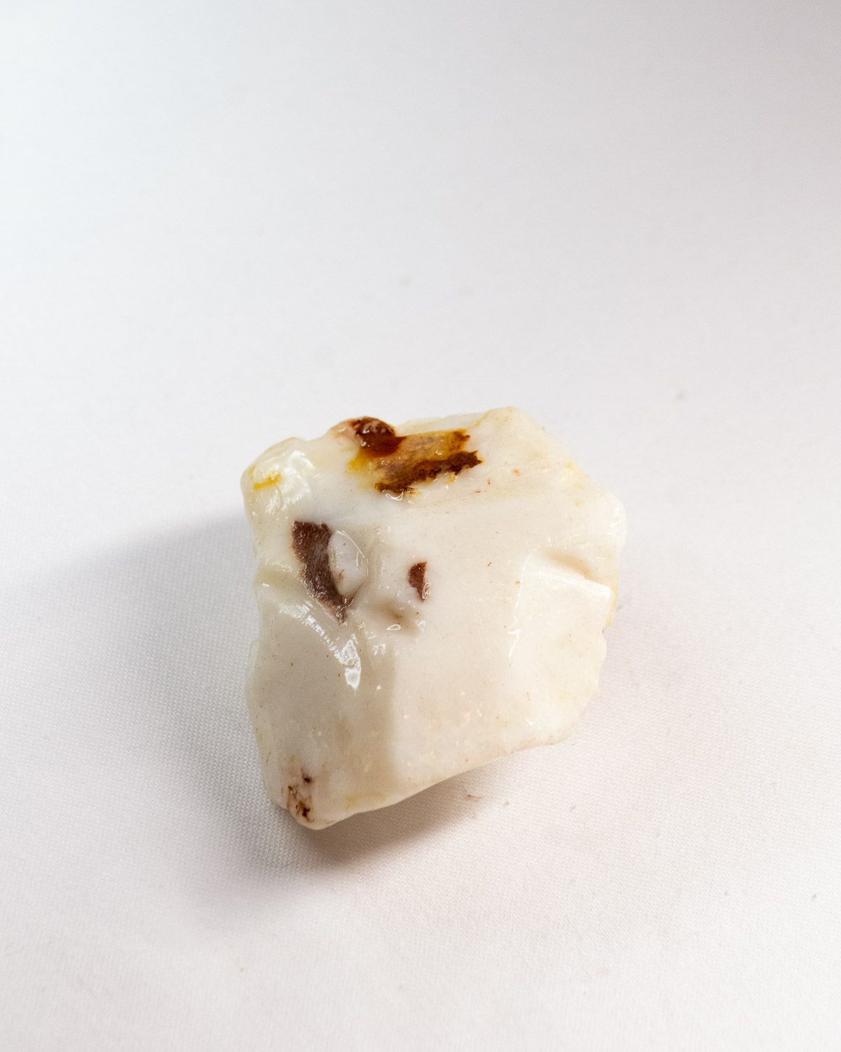 Opal No. 012, white face with small patches of brown ironstone