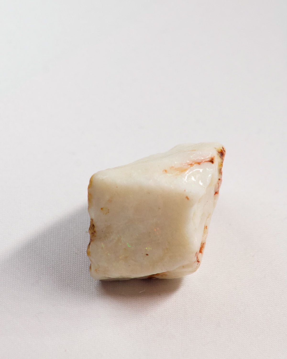 Opal No. 015, side showing colour with thin ironstone edges