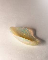 Opal No. 016, side view of the curved form with green and orange fire