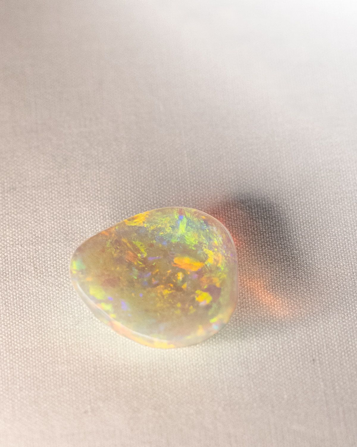 Opal No. 017, angled view of bright gold and green patches