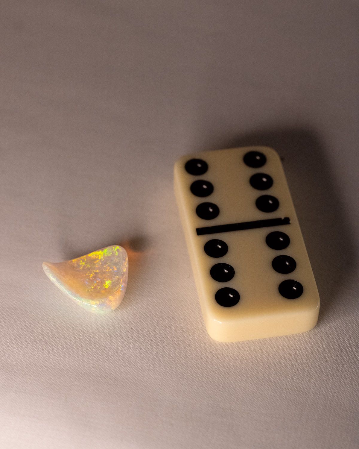 Opal No. 017 beside a domino