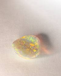Opal No. 017, angled view of bright gold and green patches