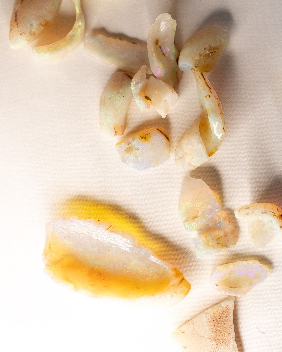 Opal No. 019, close up of several pieces showing flashes of colour