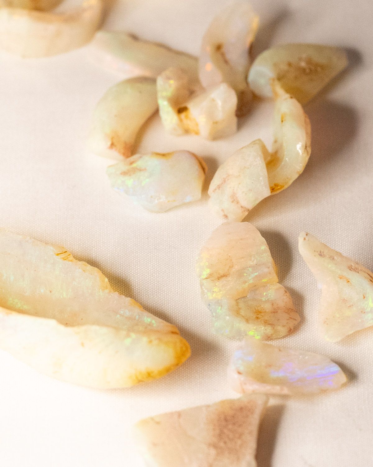 Opal No. 019, close up of pieces with green and violet fire