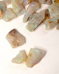 Opal No. 020, close up of a few pieces with green fire